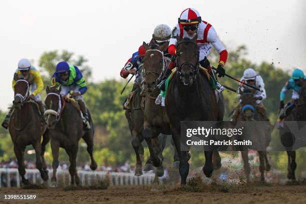 Jockey Jose Ortiz riding Early Voting crosses the finish line to win the 147th Running of the Preakness Stakes at Pimlico Race Course on May 21, 2022...