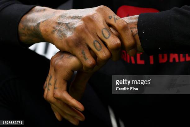 Detail view of the "100%" tattoo on Udonis Haslem of the Miami Heat's nad is seen before Game Three of the 2022 NBA Playoffs Eastern Conference...
