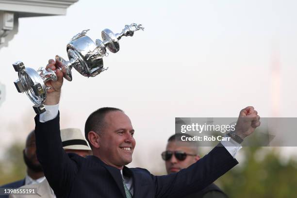 Early Voting trainer Chad Brown celebrates in the winners circle after winning the 147th Running of the Preakness Stakes at Pimlico Race Course on...