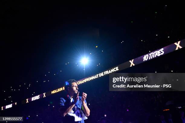 Marquinhos walks to the center of the pitch for the trophy celebration after the Ligue 1 Uber Eats match between Paris Saint Germain and FC Metz at...