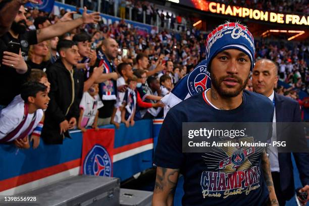 Neymar Jr of Paris Saint-Germain celebrates the championship title with fans after the Ligue 1 Uber Eats match between Paris Saint Germain and FC...