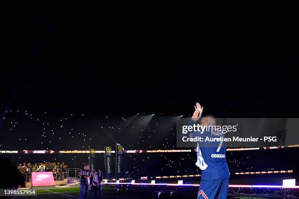 Kylian Mbappe walks to the center of the pitch for the trophy celebration after the Ligue 1 Uber Eats match between Paris Saint Germain and FC Metz...