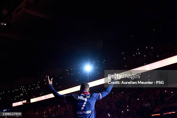 Kylian Mbappe walks to the center of the pitch for the trophy celebration after the Ligue 1 Uber Eats match between Paris Saint Germain and FC Metz...