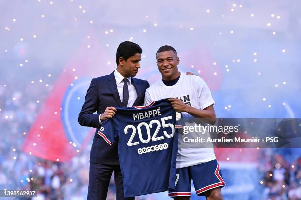 Kylian Mbappé poses with PSG President, Nasser Al-Khelaifi after extending his contract with the PSG prior to the Ligue 1 Uber Eats match between...