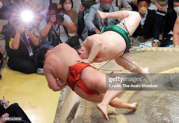 Sadanoumi throws komusubi Hoshoryu to win during day thirteen of the Grand Sumo Summer Tournament at Ryogoku Kokugikan on May 20, 2022 in Tokyo,...