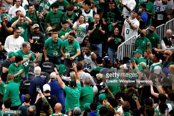 Marcus Smart of the Boston Celtics returns to the court after an injury in the third quarter against the Miami Heat in Game Three of the 2022 NBA...