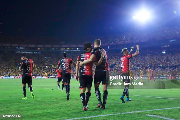Julian Quinones of Atlas celebrates with teammates after scoring his team's first goal during the semifinal second leg match between Tigres UANL and...