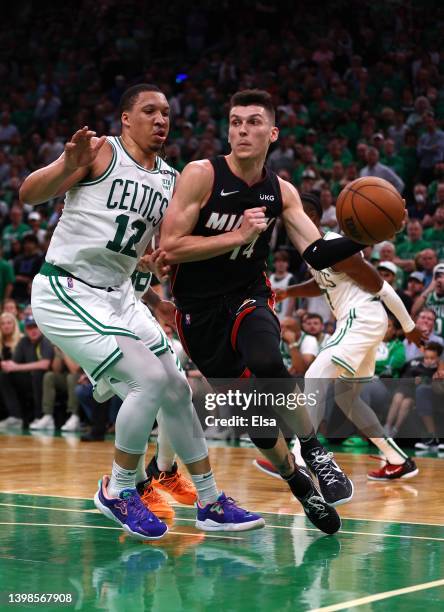 Tyler Herro of the Miami Heat handles the ball against Grant Williams of the Boston Celtics in the third uqarter in Game Three of the 2022 NBA...