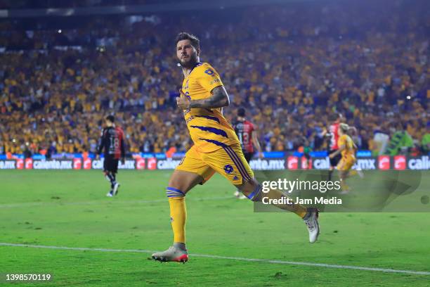 Andre-pierre Gignac of Tigres celebrates after scoring his team's third goal during the semifinal second leg match between Tigres UANL and Atlas as...