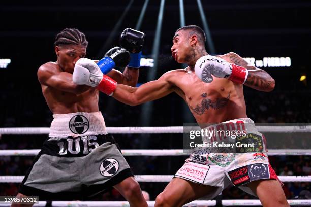 Luis Nuñez and Jonathan Fierro trade punches during their featherweight bout at Gila River Arena on May 21, 2022 in Glendale, Arizona.