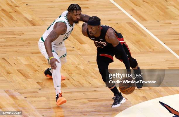Jimmy Butler of the Miami Heat handles the ball against Marcus Smart of the Boston Celtics in the second quarter in Game Three of the 2022 NBA...