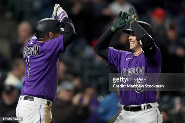 Brian Serven of the Colorado Rockies celebrates with Garrett Hampson after hitting a two RBI home run against the New York Mets in the sixth inning...