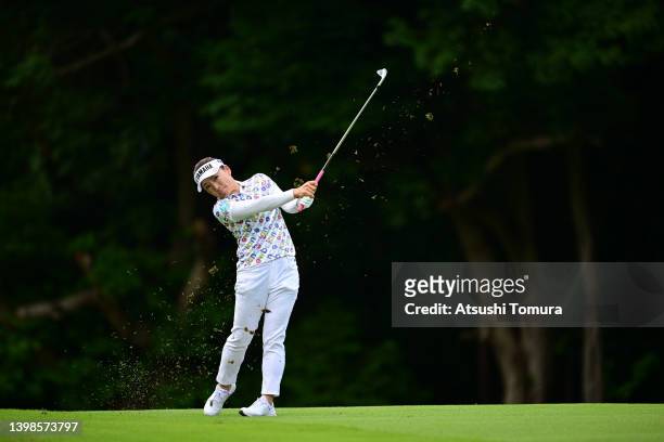 Chie Arimura of Japan hits her second shot on the 11th hole during the final round of Bridgestone Ladies Open at Sodegaura Country Club Sodegaura...