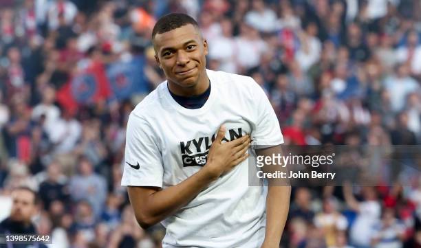 Kylian Mbappe of PSG celebrates his new contract with PSG during a brief ceremony before the Ligue 1 Uber Eats match between Paris Saint-Germain and...