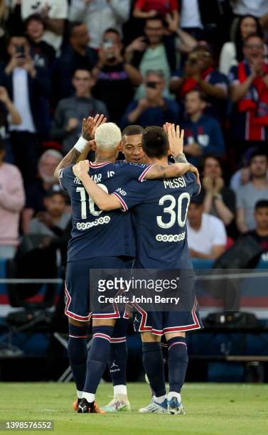 Kylian Mbappe of PSG celebrates his second goal with Neymar Jr, Lionel Messi of PSG during the Ligue 1 Uber Eats match between Paris Saint-Germain...
