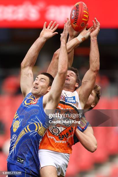 Jesse Hogan of the Giants is challenged by Jeremy McGovern of the Eagles during the round 10 AFL match between the Greater Western Sydney Giants and...