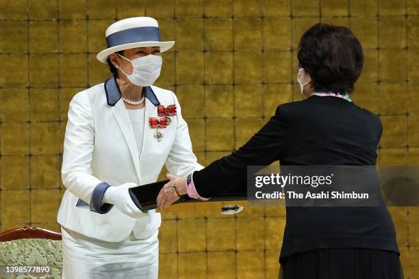 Empress Masako presents an award to a recipient during the Japan Red Cross Society national congress on May 19, 2022 in Tokyo, Japan.