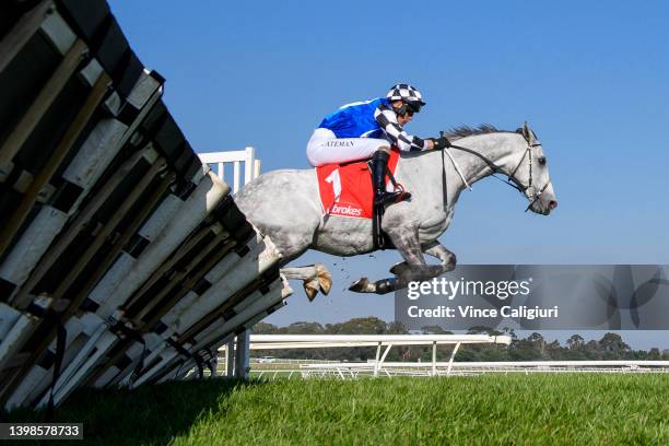 Steven Pateman riding Saunter Boy jumping hurdle before winning Race 5, the Ladbrokes Australian Hurdle, during Melbourne Racing at Sandown Lakeside...