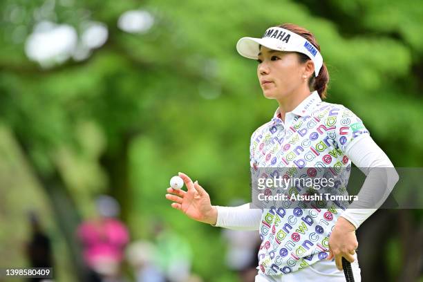 Chie Arimura of Japan acknowledges the gallery on the 13th green during the final round of Bridgestone Ladies Open at Sodegaura Country Club...