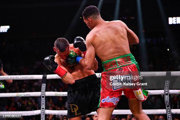 David Benavidez throws a left at David Lemieux during their WBC Super Middleweight Interim Title fight at Gila River Arena on May 21, 2022 in...