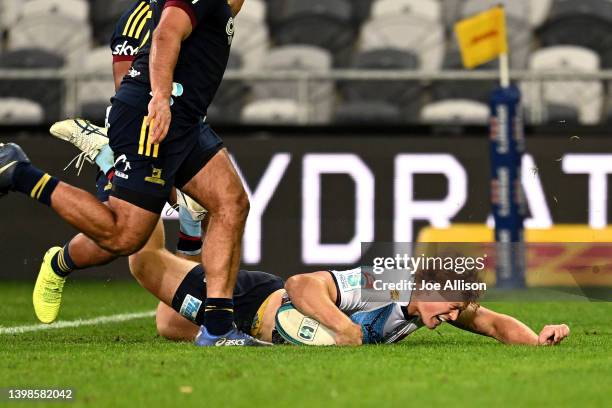 Tane Edmed of the Waratahs scores a try during the round 14 Super Rugby Pacific match between the Highlanders and the NSW Waratahs at Forsyth Barr...