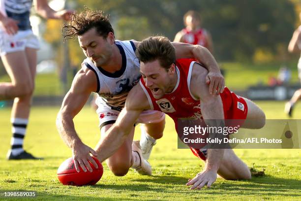 Luke Dahlhaus of the Cats and Tim Jones of the Bullants compete for the ball during the round nine VFL match between the Northern Bullants and...
