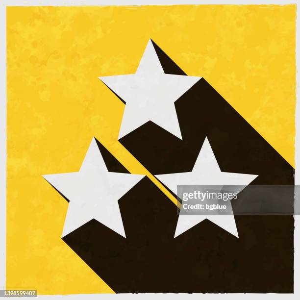 illustrations, cliparts, dessins animés et icônes de trois étoiles. icône avec une ombre longue sur fond jaune texturé - trois objets