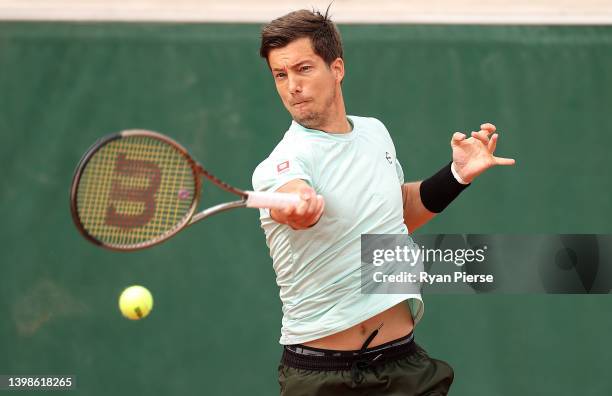 Aljaz Bedene of Slovenia plays a forehand against Christopher O'Connell of Australia during the Men's Singles First Round match on Day 1 of The 2022...