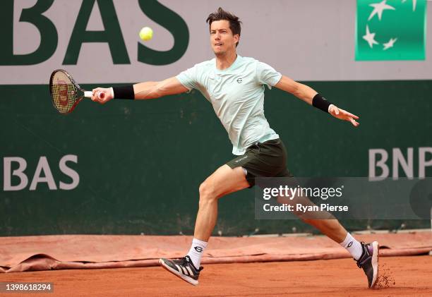 Aljaz Bedene of Slovenia plays a forehand against Christopher O'Connell of Australia during the Men's Singles First Round match on Day 1 of The 2022...