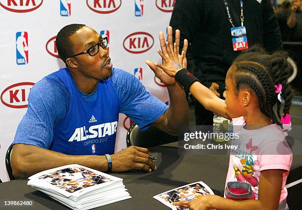 Dwight Howard Signs autographs in the Kia MVP court at Jam Session during NBA All Star Weekend on February 25, 2012 at the Orange County Convention...