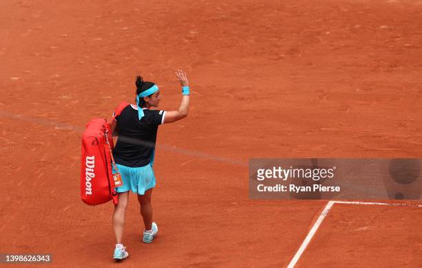 Ons Jabeur of Tunisia leaves the court after losing to Magda Linette of Poland during the Women's Singles First Round match on Day 1 of The 2022...