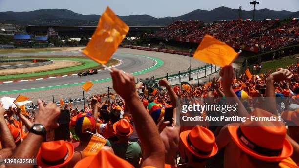 Fans cheer as Max Verstappen of the Netherlands driving the Oracle Red Bull Racing RB18 makes his way to the grid prior to the F1 Grand Prix of Spain...