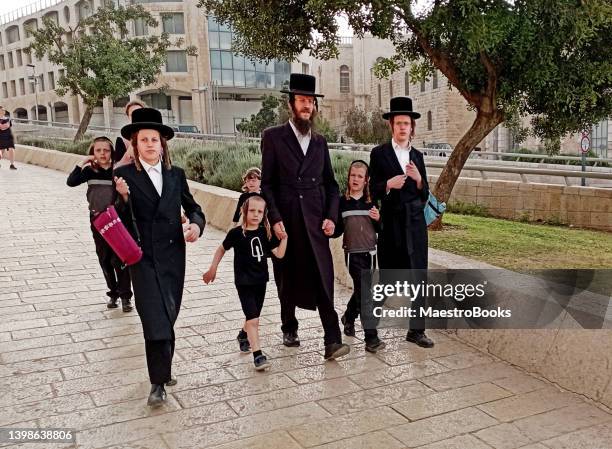 walking in jerusalem with my hasidic jewish family. - orthodox jewish family stock pictures, royalty-free photos & images