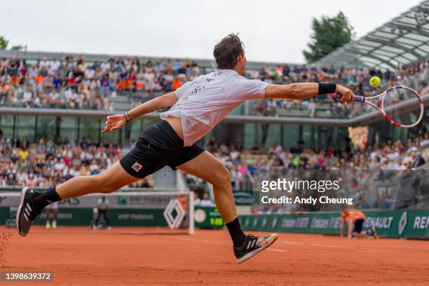 Dominic Thiem of Austria lunges to play a forehand during his Mens Singles first round match against Hugo Dellien of Bolivia on day 1 of the 2022...