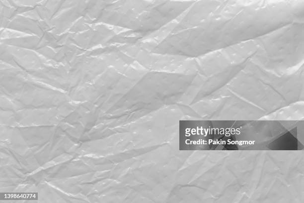 close up of white plastic foil background, abstract background of a white color made of paper. - shiny foil stock pictures, royalty-free photos & images