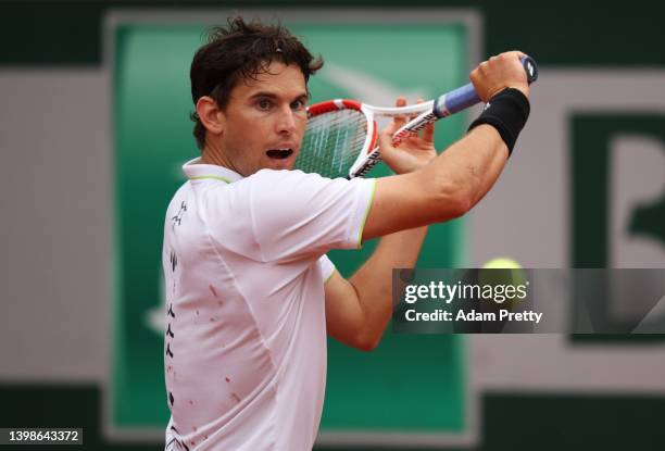 Dominic Thiem of Austria plays a backhand during his mens singles first round against Hugo Dellien of Bolivia on day 1 of the 2022 French Open at...