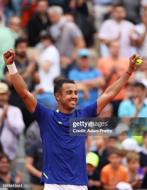 Hugo Dellien of Bolivia reacts after winning match point during his mens singles first round against Dominic Thiem of Austria on day 1 of the 2022...