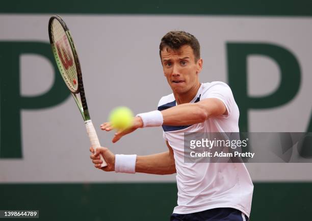 Andrey Kuznetsov plays a forehand during his mens singles first round against Diego Schwartzman of Argentina on day 1 of the 2022 French Open at...