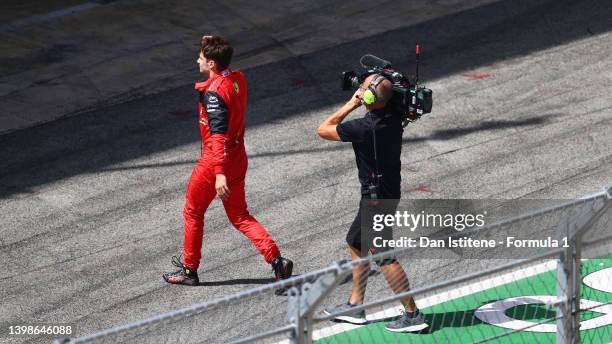 Charles Leclerc of Monaco and Ferrari walks in the Pitlane after retiring from the race during the F1 Grand Prix of Spain at Circuit de...