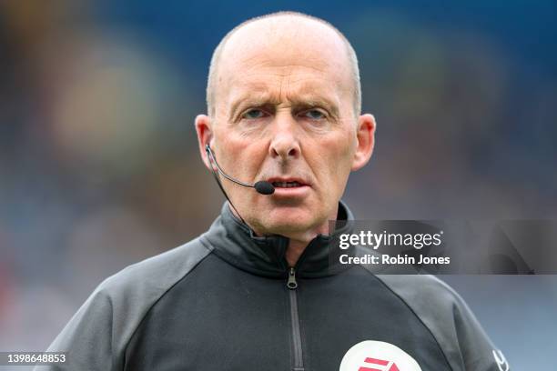 Referee Mike Dean during warm-up before the Premier League match between Chelsea and Watford at Stamford Bridge on May 22, 2022 in London, England.