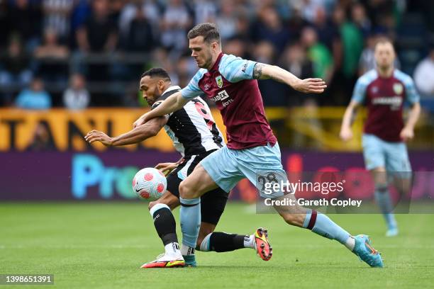 Kevin Long of Burnley battles for possession with Callum Wilson of Newcastle United during the Premier League match between Burnley and Newcastle...