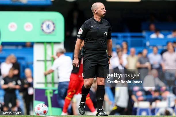 Referee Mike Dean, officiating his last game, before the Premier League match between Chelsea and Watford at Stamford Bridge on May 22, 2022 in...