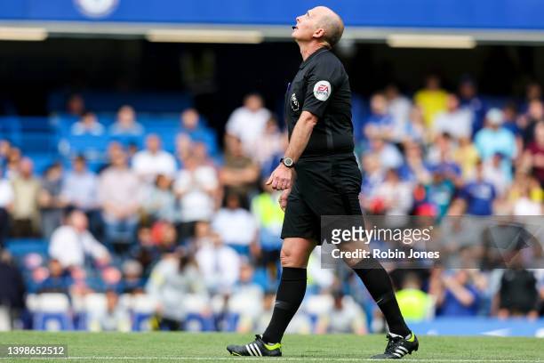 Referee Mike Dean, officiating his last game, before the Premier League match between Chelsea and Watford at Stamford Bridge on May 22, 2022 in...