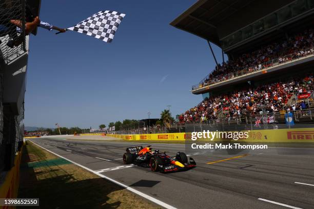 Race winner Max Verstappen of the Netherlands driving the Oracle Red Bull Racing RB18 takes the chequered flag during the F1 Grand Prix of Spain at...