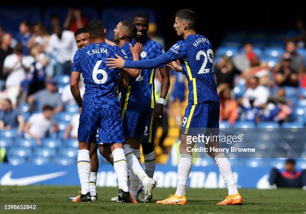 Kai Havertz of Chelsea celebrates with team mates after scoring their sides first goal during the Premier League match between Chelsea and Watford at...