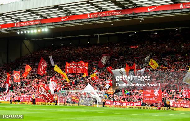 Fans of Liverpool holding up banners, scarfs and flags during the Premier League match between Liverpool and Wolverhampton Wanderers at Anfield on...