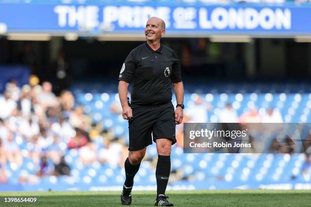 Referee Mike Dean, officiating his last game, during the Premier League match between Chelsea and Watford at Stamford Bridge on May 22, 2022 in...