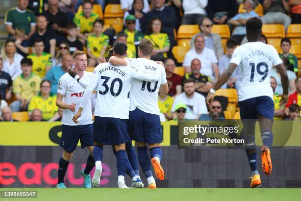 Dejan Kulusevski of Tottenham Hotspur celebrates with teammates after scoring their side's first goal during the Premier League match between Norwich...