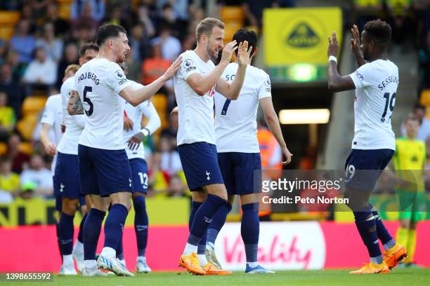 Harry Kane of Tottenham Hotspur celebrates with teammates Pierre-Emile Hojbjerg and Ryan Sessegnon after scoring their side's second goal during the...