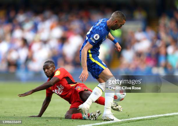 Hassane Kamara of Watford FC battles for possession with Hakim Ziyech of Chelsea during the Premier League match between Chelsea and Watford at...